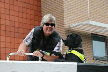 Tracey and Oakley, the crew of nb Sola Gratia, opening a lock gate